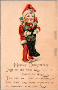 Merry Christmas, Child Dressed as Santa Hugging Stocking Vintage Postcard Y45
