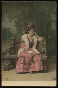 Woman on park bench reflects. 1909 colored real photo postcard. ELD