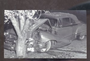 REAL PHOTO 1951 PONTIAC CHIEFTAIN WRECKS INTO A TREE POSTCARD