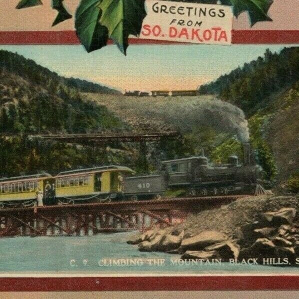 Train Black Hills South Dakota Voedisch's Jeweler Christmas New Years Postcard