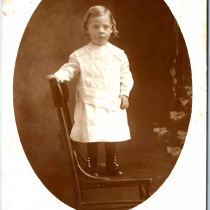 ID'd c1900s Cute Little Boy or Girl Portrait RPPC Stand Chair Real Photo PC A184