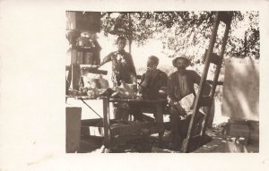 MAN SHAVING & MEN SITTING AT OUTSIDE TABLE-1910s REAL PHOTO POSTCARD