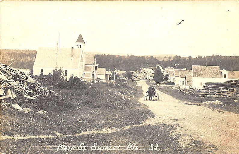 Shirley ME Dirt Main Street View Horse & Wagon Lumber 1911 RPPC Postcard