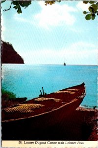 VINTAGE CONTINENTAL SIZE POSTCARD DUGOUT CANOE & LOBSTER POTS ST.LUCIA STAMPS 80