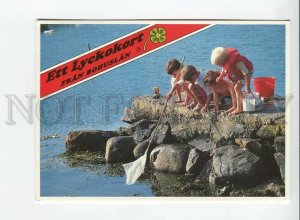 435662 Sweden children fishing with butterfly net horses on stamp RPPC