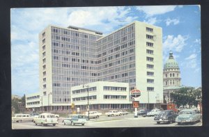 TOPEKA KANSAS DOWNTOWN STREET SCENE 1950s CARS GAS STATION VINTAGE POSTCARD