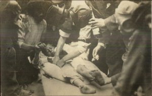 Doctor Attend to Child - Crowd Candid Action Amateur Real Photo Postcard c1910