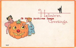 329667-Halloween, Bergman No 7035-5, Young Boy & Girl Trying to Move Large JOL