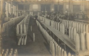 RPPC Postcard WWI Era Munitions Factory Workers Room Full Of Shells Bullets