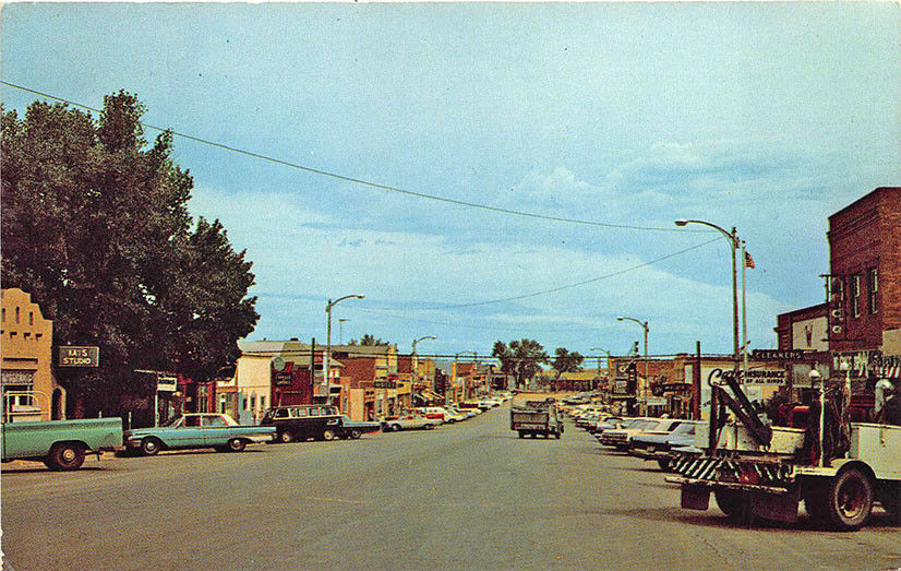 Gillette WY Street View Store Fronts Tow Truck Wrecker Old Cars Postcard United States