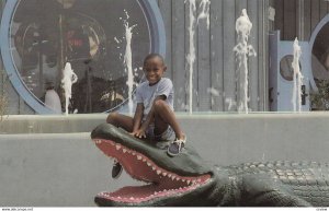 Black Child on an alligator's State Head , SOUTH OF THE BORDER , South Caroli...