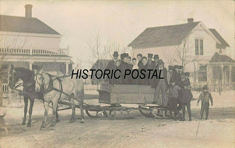 LARGE GROUP OF PEOPLE IN WOOD SLEIGH PULLED BY TEAM HORSES~REAL PHOTO POSTCARD