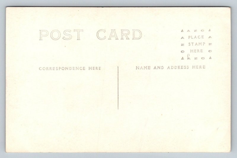 RPPC   Model T Ford  Guys Putting Snow Mud Chains on Tires  Postcard