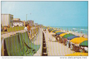 Virginia Beach Sun Bathers Enjoying The Warm Sun And Foaming Surf At This Bea...