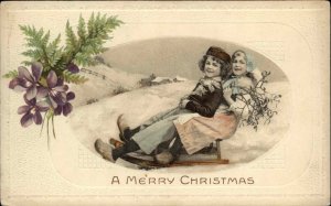 Christmas Children Sledding Flowers Embossed c1900s-10s Postcard