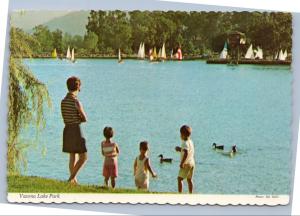 Mother and Children watching ducks at Vasona Lake Park