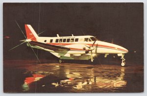 Transportation~Christman Air System Plane~Beech C-99 @ Night~1960s Postcard
