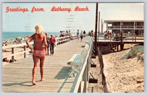1970 GREETINGS FROM BETHANY BEACH DELAWARE PINK BIKINI GIRL BOARDWALK POSTCARD