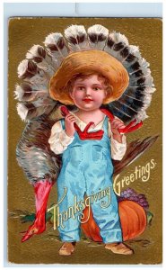 1908 Thanksgiving Greetings Little Boy Cached Turkey Fruits Embossed Postcard