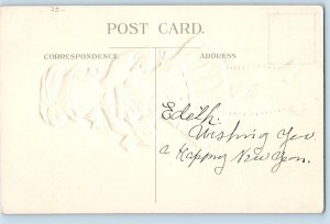 Christmas Postcard Pretty Young Girl With Gift And Candy Cane Embossed c1910's