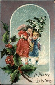 Christmas Cute Kids Children with Tree in Snow c1910 Vintage Postcard