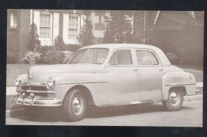 1950 PLYMOUTH DELUXE SEDAN VINTAGE CAR DEALER ADVERTISING POSTCARD MOPAR