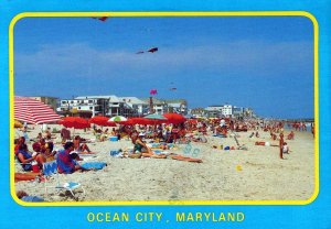 VINTAGE POSTCARD CONTINENTAL SIZE RELAXING ON THE BEACH AT OCEAN CITY MARYLAND