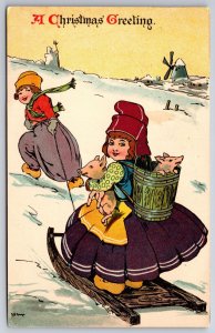Ernest Nister Christmas~Dutch Boy Pulls Girl on Sled~Pet Pigs~Artist Sign~1910