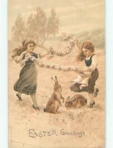 Pre-1907 easter PAIR OF CUTE GIRLS PLAY WITH THE BUNNY RABBITS W7370