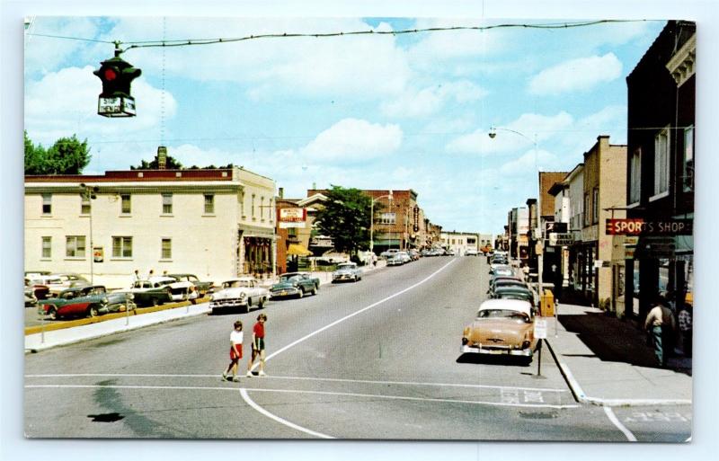 Postcard NY Tupper Lake 1950's Main Street View Old Cars & Storefronts  I7