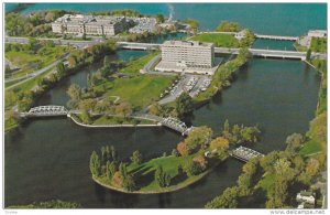 Ottawa City sitting in a park-like area in the mouth of the Rideau River, OTT...