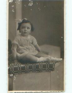 Edge Wear c1910 rppc LITTLE GIRL WITH BOW IN HAIR WEARS JESUS CROSS o2712