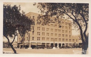 J79/ Del Rio Texas RPPC Postcard c1920s Roswell Hotel Building Autos 437