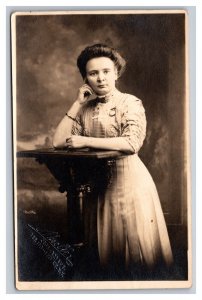 Vintage 1910's RPPC Postcard Studio Portrait Woman White Dress Posing Table