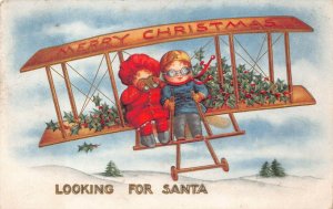 MERRY CHRISTMAS HOLIDAY AIRPLANE CHILDREN LOOKING FOR SANTA CLAUS POSTCARD 1913