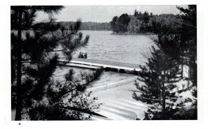 View Through the Trees of a Lake and 3 Women Sitting on the Dock RPPC Postcard