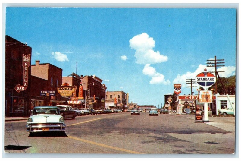 c1950s Looking West On Front Street Standard Chevrolet Evanston Wyoming Postcard