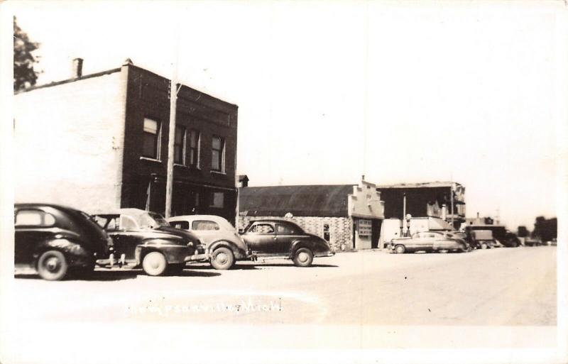 Thompsonville MI1940s Cars Parked in Front of ShopsService StationRPPC 1952