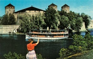 SAVOLINNA, Finland   OLAVINLINNA CASTLE  Woman Waving At Tour Boat   Postcard