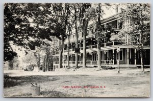 New London New Hampshire~Hotel Sargent~Sign Hangs From Tree~1909 B&W Postcard