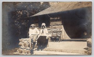 RPPC Old Log Cabin Homestead Couple Porch Woman Bonnet Stone Wall Postcard P28