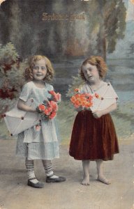 A062 Greetings 1912 Girls holding flowers bouquet and letters vintage postcard