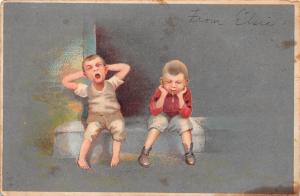 TWO BOYS SITTING ONE YAWNING THE OTHER SPITTING ARTIST DRAWN COMIC POSTCARD 1907