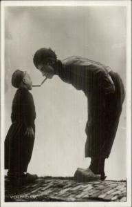 Dutch Boy & Father Smoking Cigarettes in Native Costumes Real Photo Postcard