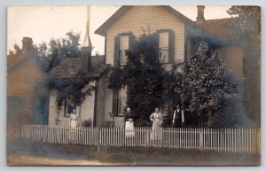 RPPC Lovely Family Very Old Women Yard Picket Fence Unique Chimney Postcard O21