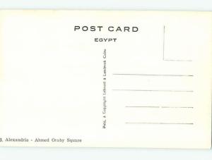 old rppc STATUE BY OLD BUSES AND BUILDINGS Alexandria Egypt HM1867