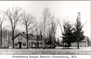 RPPC Grantsburg Wisconsin Grantsburg Ranger Station Old Cars Truck Postcard X7