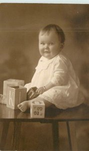 C-1910 Baby building blocks Vincent Mitchell RPPC Photo Postcard 22-8996