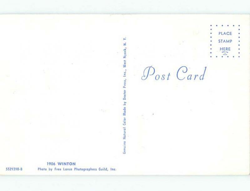 Unused 1970's postcard ANTIQUE CIGAR STORE INDIAN BESIDE 1906 WINTON CAR k9064