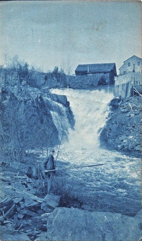 YOUNG MAN WITH STICK AT BOTTOM OF WATERFALL-CYANO GRAPH REAL PHOTO POSTCARD 1910
